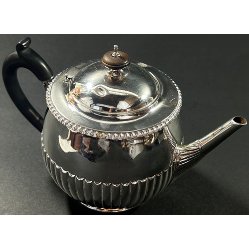 212 - A small half fluted designed tea pot, hallmarks rubbed, London, 1889, 9.1oz all in