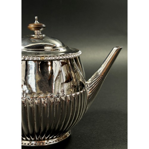 212 - A small half fluted designed tea pot, hallmarks rubbed, London, 1889, 9.1oz all in