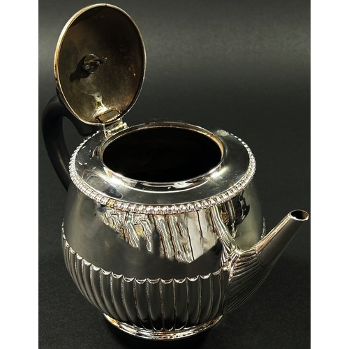 212 - A small half fluted designed tea pot, hallmarks rubbed, London, 1889, 9.1oz all in