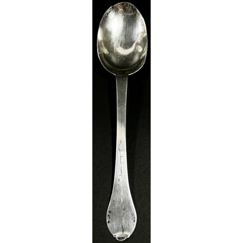 213 - An early 18th Century silver dog nose designed table spoon, etched with the initials 'W.H.S' to the ... 