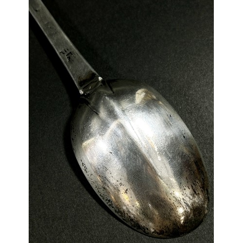 213 - An early 18th Century silver dog nose designed table spoon, etched with the initials 'W.H.S' to the ... 