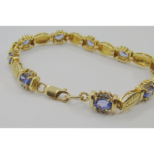 251 - 14ct oval tanzanite and diamond cluster bracelet, 19.5cm L approx, 17.1g