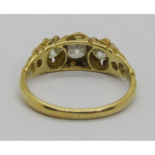 257 - Victorian yellow metal three stone old-cut diamond ring, centre stone 0.45ct approx, outer stones ea... 