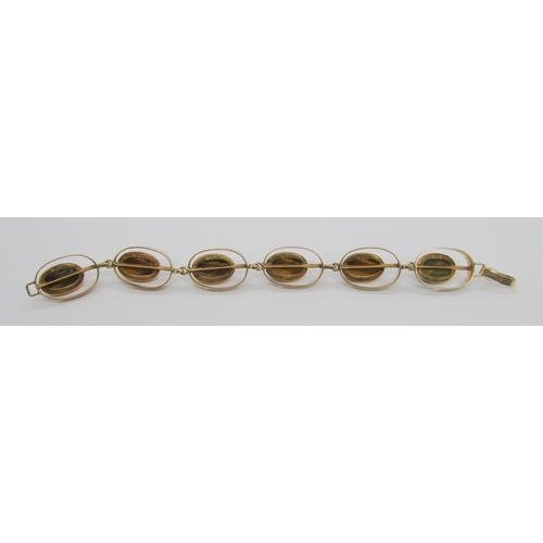 285 - Stylised vintage 9ct cabochon tigers eye bracelet with six oval links, possibly Scandinavian, stampe... 