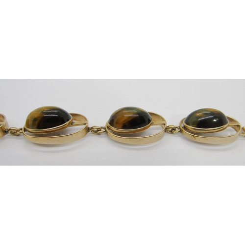 285 - Stylised vintage 9ct cabochon tigers eye bracelet with six oval links, possibly Scandinavian, stampe... 