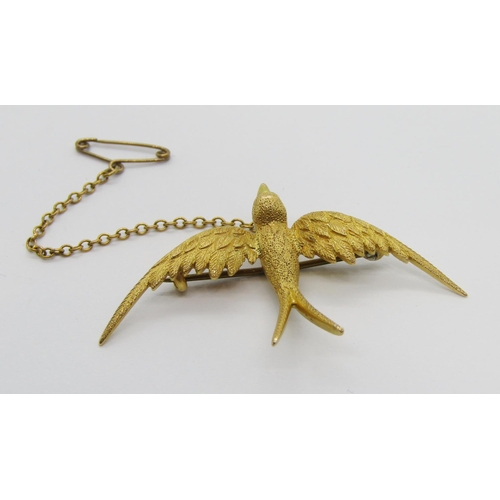 290 - Turn of the century 15ct swallow brooch, 4.5cm W approx, 3.6g