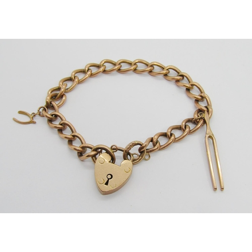 301 - 9ct curb link bracelet with heart padlock clasp, maker 'ACC', with attached 9ct tuning fork and hors... 