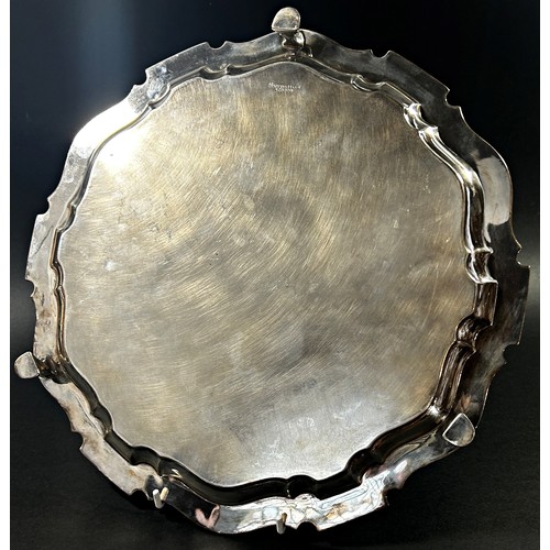 222 - A large early 20th century Sheffield Mappin & Webb 1908 silver salver with scalloped edge on three p... 