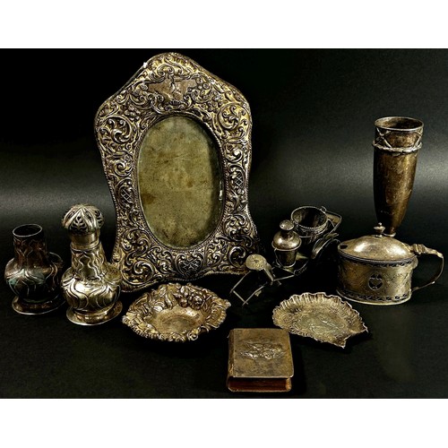 218 - A mixed selection of English silver ware including a photo frame, cruets, trays, condiments a small ... 