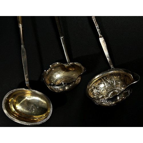 219 - Three Georgian silver toddy ladles, a silver plated listening tube a Ronson table lighter and a comm... 