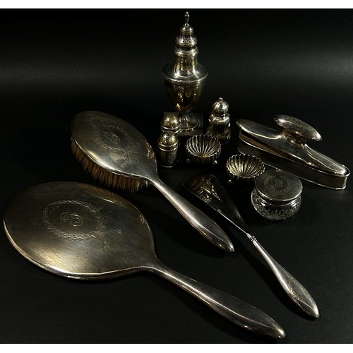 226 - A mixed quantity of silver ware including condiments, sugar caster, a sugar sifting spoon, hand mirr... 