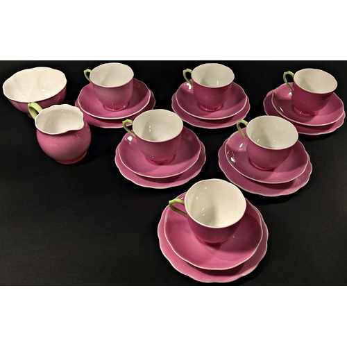 104 - A quantity of pink ground Royal Albert bone china tea wares, the cream jug and cup handles with gree... 