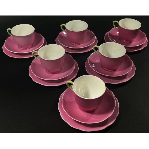 104 - A quantity of pink ground Royal Albert bone china tea wares, the cream jug and cup handles with gree... 