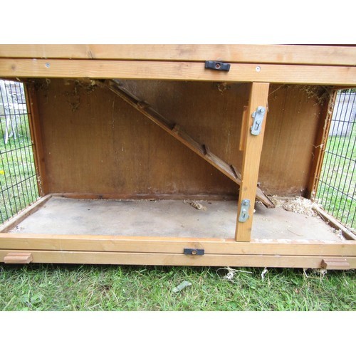 1227 - A two tier wooden rabbit hutch with hinged lid 105 cm high x 120 cm wide