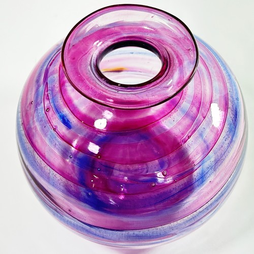 147 - A large Isle of Wight studio glass ‘globe’ vase, banded with pink and blue swirls, with flame mark t... 