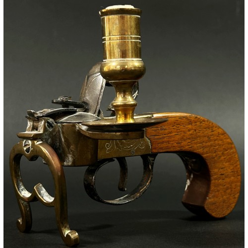 377 - An Italian novelty reproduction tinder pistol table lighter with flintlock action brass framework an... 