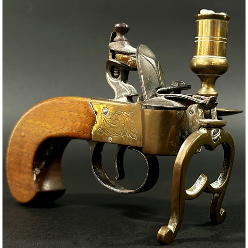 377 - An Italian novelty reproduction tinder pistol table lighter with flintlock action brass framework an... 