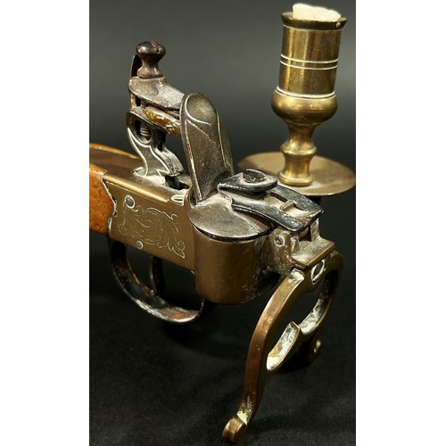 377 - An Italian novelty reproduction tinder pistol table lighter with flintlock action brass framework an... 