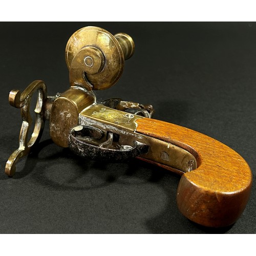 377 - An Italian novelty reproduction tinder pistol table lighter with flintlock action brass framework an... 