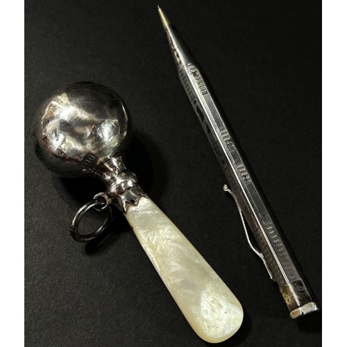 379 - A small collection of bijouterie to include an infant’s silver plated rattle, a yard of lead pencil,... 