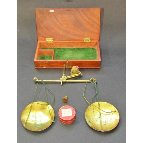 382 - A cased set of 19th century brass travelling balance scales with grain weights, set within fitted ma... 