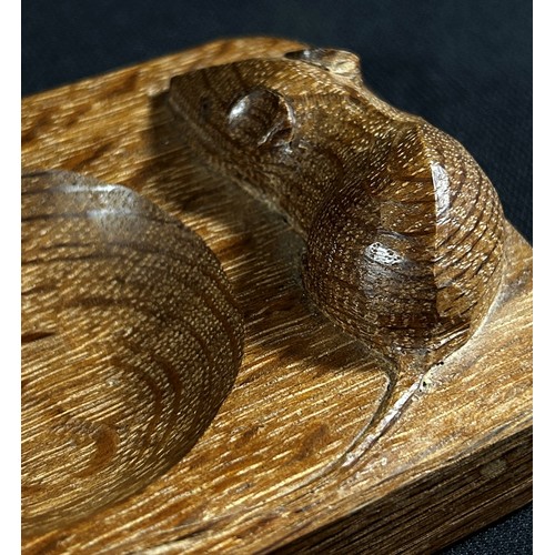 385 - A Robert Thompson of Kilburn 'Mouseman' oak pin tray surmounted by a long tailed mouse, 10 x 8cm.