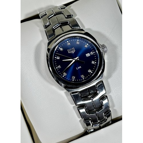 412 - Tag Heuer: A ladies’ stainless steel ‘LINK’, with blue metalic dial, with diamond spacers and date a... 