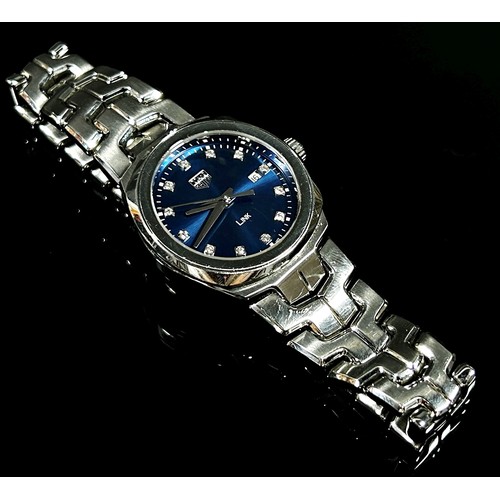 412 - Tag Heuer: A ladies’ stainless steel ‘LINK’, with blue metalic dial, with diamond spacers and date a... 