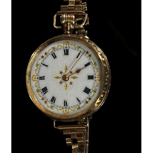 414 - An Edwardian 9ct yellow gold cased Swiss fob watch, the enamel dial with Roman numerals with gilt bo... 