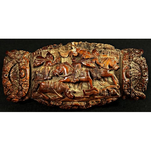 378 - A large 19th century coquilla nut snuff box, with hinged cover, profusely carved with a chariot scen... 