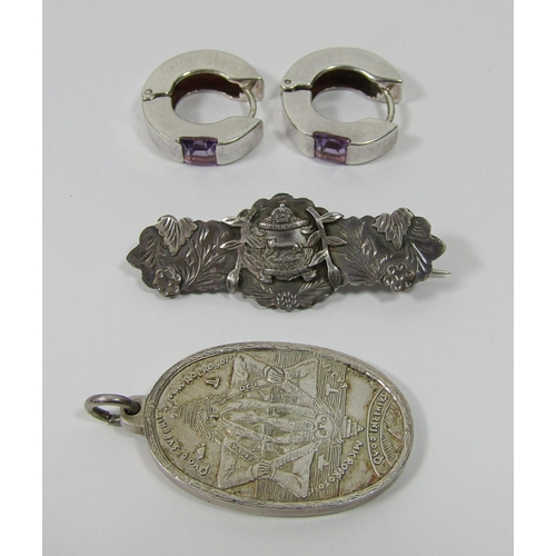 340 - Collection of silver jewellery comprising a pair of amethyst set hinged hoop earrings, a 1970s Seal ... 