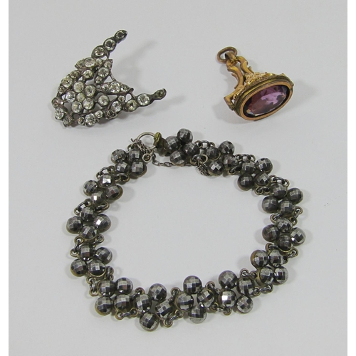 343 - Group of 19th century jewellery to include a cut steel bracelet, a gilt seal fob set with amethyst c... 