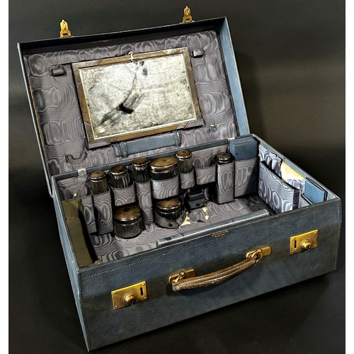 233 - A good Edwardian cased travelling vanity case, with brass lock plates, in stitched blue leather with... 