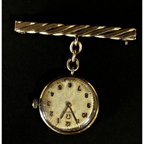 416 - Omega: A 9ct yellow gold cased nurse’s fob watch, with raised gold Arabic numerals on a champagne di... 