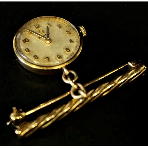 416 - Omega: A 9ct yellow gold cased nurse’s fob watch, with raised gold Arabic numerals on a champagne di... 