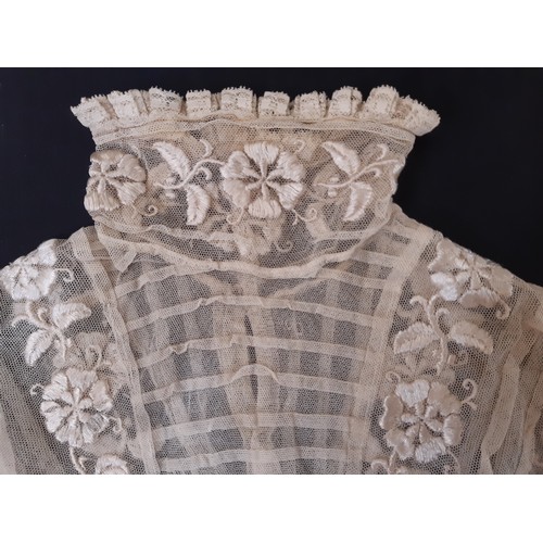 920 - Edwardian ladies' blouse of embroidered lace net with high collar trimmed with hand made lace, tight... 