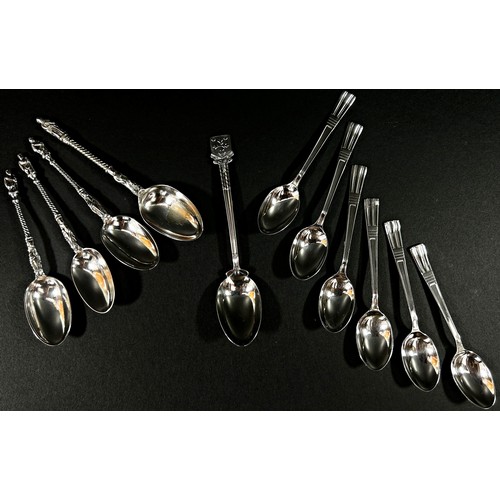 243 - A cased set of six silver coffee spoons, and four further silver tea spoons, 3.4 oz (sold on behalf ... 