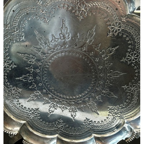 239 - A Victorian silver card tray with scalloped edge and floral engravings, raised on scrolled feet, Lon... 