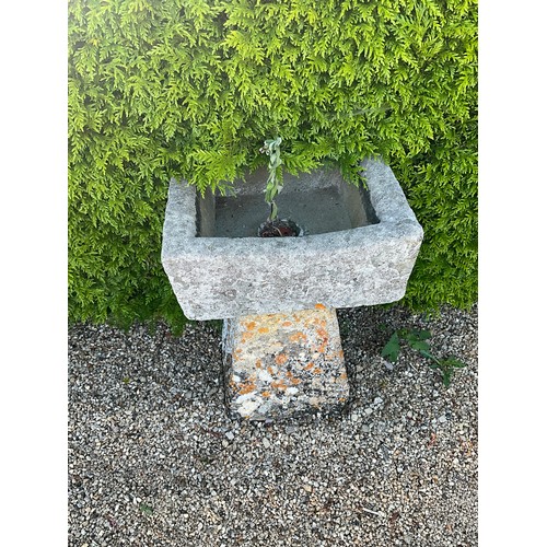 1006 - A small weathered natural stone planter / trough of rectangular form raised on associated tall stadd... 