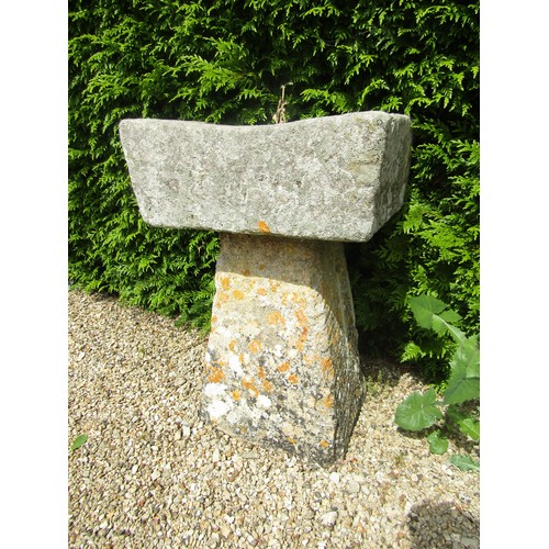 1006 - A small weathered natural stone planter / trough of rectangular form raised on associated tall stadd... 