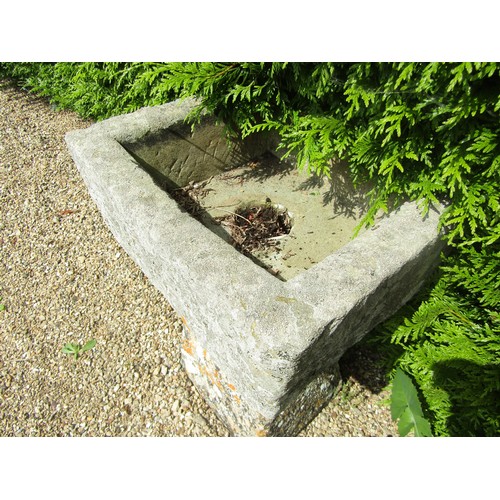 1006 - A small weathered natural stone planter / trough of rectangular form raised on associated tall stadd... 