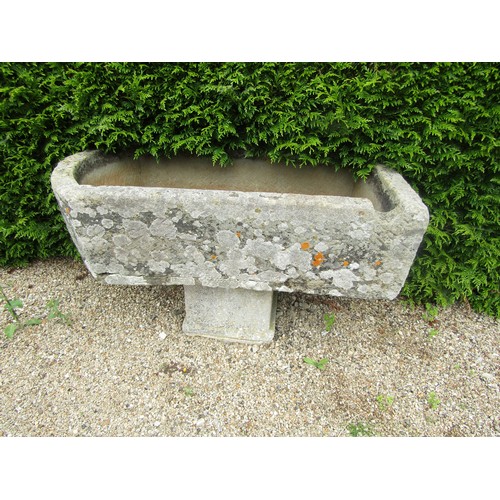 1008 - A large weathered natural stone planter / trough of rectangular form with rounded end and carved cha... 