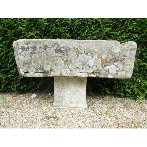 1008 - A large weathered natural stone planter / trough of rectangular form with rounded end and carved cha... 