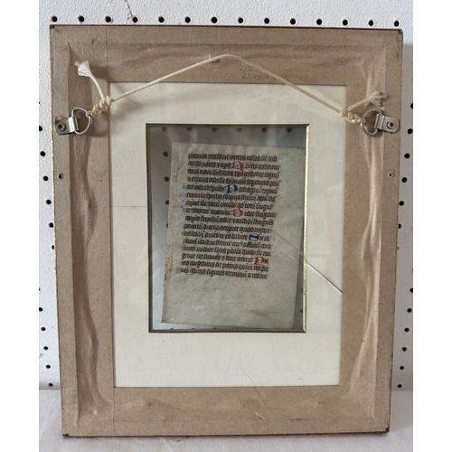 1984 - A framed manuscript leaf, probably from a Book of Hours, calligraphy in ink and polychromatic pigmen... 