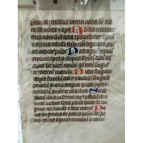 1984 - A framed manuscript leaf, probably from a Book of Hours, calligraphy in ink and polychromatic pigmen... 