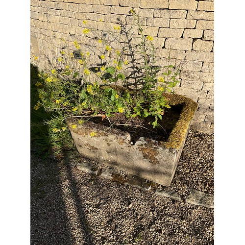 1010 - A small weathered natural stone planter / trough of rounded rectangular form with carved channel.

F... 