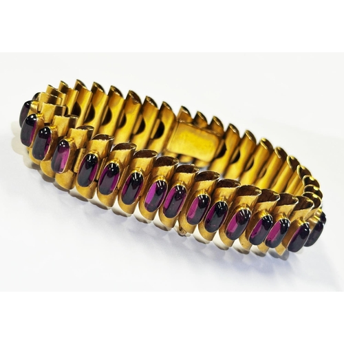 322 - Fine antique yellow metal cabochon garnet line bracelet, the folded tubular links set with thirty-fi... 