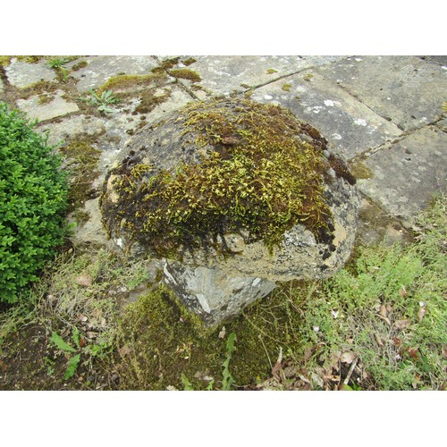 1014 - A  tall natural stone staddle stone and cap, 73cm high, 50cm diameter approximately (cap uneven with... 