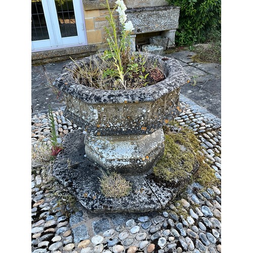 1015 - A large and impressive weathered carved composition sectional stone font / planter of octagonal form... 