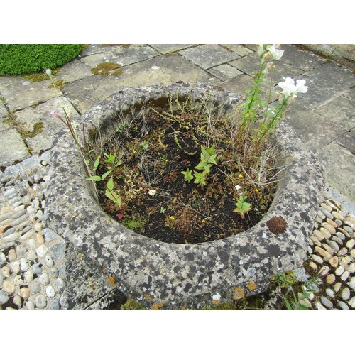 1015 - A large and impressive weathered carved composition sectional stone font / planter of octagonal form... 